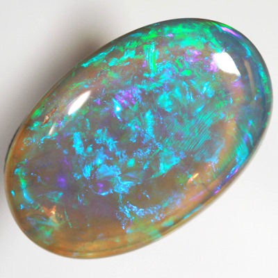 SOLID BLACK CRYSTAL OPAL Very bright greens over a purple hue SEE VIDEO